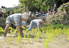 Community members pray for good harvest at Ueda Ugan