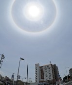 Ring of light surrounding the sun appears in sky