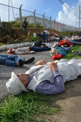 Nine years since U.S. helicopter crash onto Okinawa International University: Protesters stage a “die-in rally” in front of Marine base