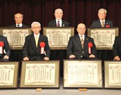 Seven karate masters receive service awards
