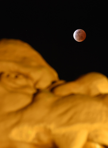 Reddish-brown moon appears during total eclipse