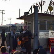 Henoko: American peace movement participant Loan directs song to those inside base