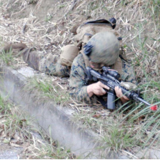Citizens see US soldier holding gun along roadside in Kunigami