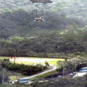 JSDF aircraft carry heavy equipment over prefectural road for U.S. helipad construction