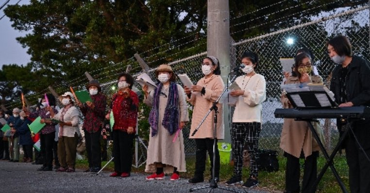 Okinawa Christians sing outside U.S. military base wishing for a peaceful world without fence