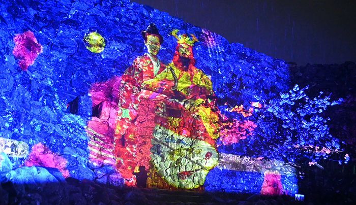 Hokuzan king makes an appearance at Nakijin Castle at night! The world heritage site’s castle wall get a vibrant light-up display