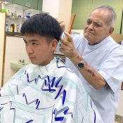 After 48 years in business, barbershop owner in Nago cuts his grandson’s hair for his final customer