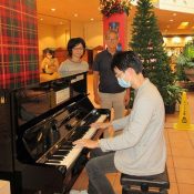 Okinawa City resident donates street piano to Plaza House Shopping Center